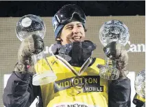  ?? JACQUES BOISSINOT/THE CANADIAN PRESS FILES ?? Mark McMorris, seen holding his Crystal Globes in February, says he thought he would be unable to snowboard again after a disastrous crash in March.
