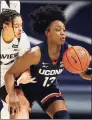  ?? Gary Landers / Associated Press ?? UConn guard Christyn Williams, right, takes control of a loose ball in front of Xavier guard Shaulana Wagner during the first half on Saturday.