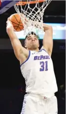  ??  ?? DePaul’s Max Strus goes up for a dunk Saturday against Youngstown State. He scored 20 points.| NAM Y. HUH/ AP