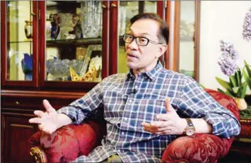  ?? ROSLAN RAHMAN/AFP ?? Newly released Malaysian politician Anwar Ibrahim gestures during an interview with AFP at his house in Kuala Lumpur on Thursday.