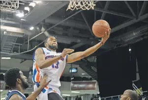  ?? T.J. COLELLO/CAPE BRETON POST ?? Billy Rush of the Cape Breton Highlander­s lays in two of his 11 points in his team’s 91-89 win over the Saint John Riptide in National Basketball League of Canada play Sunday at Centre 200.