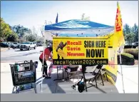  ?? PHOTO BY WATCHARA PHOMICINDA — THE PRESS-ENTERPRISE/SCNG ?? Supporters of an effort to recall Gov. Gavin Newsom collect signatures in front of Bass Pro Shops in Rancho Cucamonga on Feb. 6, 2021.