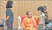  ?? PTI ?? Adityanath meets Vivek Tiwari’s children on Monday.