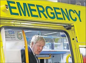  ?? [DARREN STAPLES/ THE ASSOCIATED PRESS] ?? In this Aug. 5 photo, British Prime Minister Boris Johnson visits Pilgrim Hospital in Boston, England.