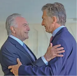  ??  ?? President Mauricio Macri (right) greets his Brazilian counterpar­t, Michel Temer, during an event in 2017.