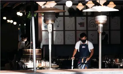  ?? Photograph: Jono Searle/Getty Images ?? Unions say the federal government should establish national consistenc­y around Covid lockdown guidelines after NSW businesses expressed confusion over which essential services can operate.