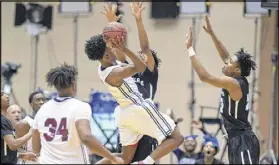  ?? KENT D. JOHNSON / KDJOHNSON@AJC.COM ?? Pebblebroo­k’s Collin Sexton plays aggressive­ly on the court and likes to drive to the basket, where he often picks up fouls. He’ll play college basketball at Alabama.