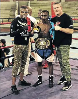  ?? / SUPPLIED ?? Clement Kamanga is flanked by trainers Junior Asoya and Lionel Hunter after his win over Tshifhiwa Munyai.