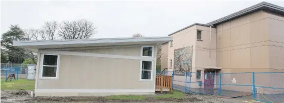  ??  ?? A new portable, nicknamed The Cottage, opens at Quadra Elementary school. The specially designed structures boast a 50-year lifespan.