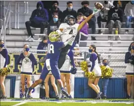  ?? Allen J. Schaben Los Angeles Times ?? SERVITE WIDE RECEIVER Tetairoa McMillan leaps high but can’t haul in a pass while being covered by St. John Bosco cornerback Jahlil McClain.