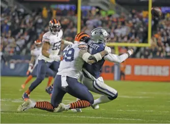 ?? MORRY GASH/AP ?? Aaron Lynch puts a hit on Cowboys quarterbac­k Dak Prescott, who finished with an 83.2 rating.