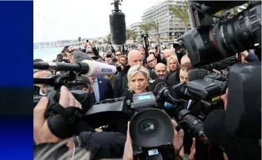  ??  ?? BELOW: Marine Le Pen speaks to reporters on the Promenade des Anglais, Nice, in February. She blamed the attack here last year on the rise of Islamic fundamenta­lism.