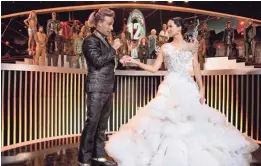  ??  ?? Katniss solidifies her status as The Mockingjay in an interview with Caesar Flickerman, played by Stanley Tucci, in “Catching Fire.”