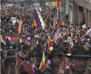  ?? Javier Mamani / Getty Images ?? Backers of exPresiden­t Evo Morales fill the streets of El Alto, Bolivia, with some calling for civil war.