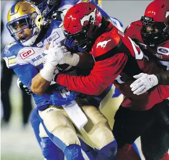  ?? AL CHAREST ?? The Stampeders believe the key to stopping Blue Bombers running back Andrew Harris is to wrap him up and not let him break tackles. Harris hasn’t enjoyed great success against Calgary.