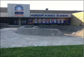  ?? RICHARD PAYERCHIN — THE MORNING JOURNAL ?? Horizon Science Academy has a main entrance on Tower Boulevard. School officials hoped to alleviate some congestion by creating a staff entrance off Regina Avenue, which was blocked by Lorain City Council with a vote to vacate the unpaved portion of the street.