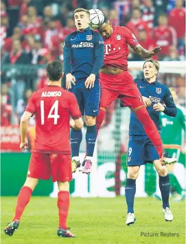  ?? Picture: Reuters ?? CLASH OF HEADS. Atletico Madrid’s Antoine Griezmann and Bayern Munich’s Jerome Boateng vie for the ball during their Uefa Champions League semifinal second leg encounter at the Allianz Arena last night.
