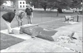  ?? AP Photo/Jill Zeman Bleed, File ?? Destroyed: In this June 28, 2017 file photo, personnel from the Secretary of State's office inspect damage to the new Ten Commandmen­ts monument outside the state Capitol in Little Rock, after Michael Tate Reed crashed into it with a vehicle. A judge on...