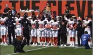  ?? DAVID RICHARD — THE ASSOCIATED PRESS ?? Members of the Cleveland police and the Cleveland Browns players stand together during the national anthem before an NFL football game between the Pittsburgh Steelers and the Cleveland Browns, Sunday, Sept. 10, in Cleveland.