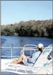  ?? Chicago Tribune/TNS/NANCY MORELAND ?? The top deck of a houseboat is a good spot to relax and take in the view of the St. Johns River in Florida.