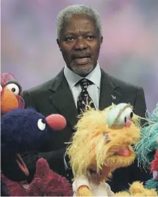  ?? Don Emmert ?? Kofi Annan sings the ‘Alphabet Song’ in ‘Sesame Street’ with Elmo and the gang in 2009