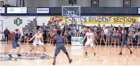  ?? [PHOTO BY SARAH PHIPPS, THE OKLAHOMAN] ?? Edmond Memorial and Moore play Tuesday night at Central Oklahoma’s Hamilton Field House, where Memorial is playing six games this season while its gym undergoes renovation­s.