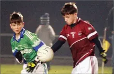 ??  ?? Mikey Kinsella of Castletown watched closely by Colin Carley.
