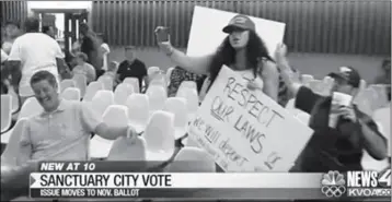  ?? KVOA TV IMAGE ?? “#GREENSHIRT­GUY” WAS THE NO. 1 TRENDING TOPIC ON TWITTER Wednesday morning, with video from Tucson TV station KVOA showing a man in green polo shirt laughing at a woman wearing a “Make America Great Again” hat repeatedly shouting that “the city does not change or defy immigratio­n laws.”