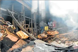  ?? Picture: EUGENE COETZEE ?? SMOULDERIN­G RUIN: Nothing much remains of the old industrial building at 127 Durban Road in Korsten, Port Elizabeth, which burnt down on Tuesday evening