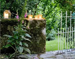  ??  ?? JAM JARS can make magical lighting to dress tables, top walls and line paths for an alfresco soirée (right). Recycle attractive jars, washing them first and removing the labels