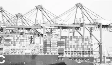  ??  ?? A container ship is shown at port in Long Beach, California, US. — Reuters photo