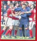  ??  ?? SCUFFLE Boro and United players shove each other as tempers flare