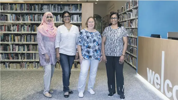  ?? Reem Mohammed / The National ?? From left, Wajeeha Faiz, chairwoman, Liv Nair, coordinato­r, Michele Sadoon, vice chairwoman, and Tara Dudhia, treasurer of the Old Library, at the new premises in Dubai; left, the library reopened yesterday, four months after Ductac’s closure