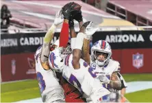  ?? Ross D. Franklin / Associated Press ?? Somewhere in this mass of Buffalo defenders, Arizona wide receiver DeAndre Hopkins is catching the gamewinnin­g TD.