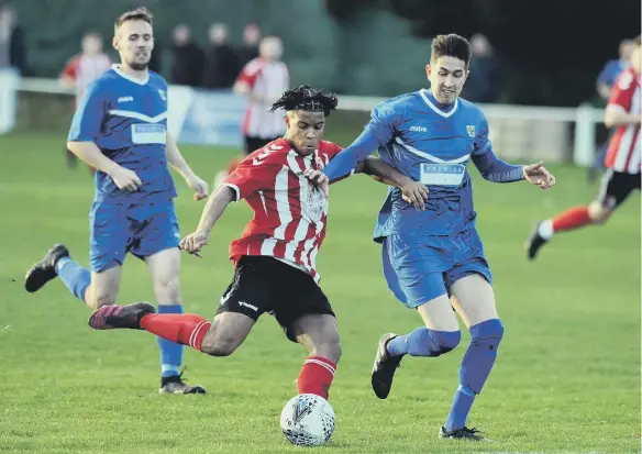  ?? ?? Sunderland RCA, in red and white, went down 2-1 at home to Consett in the Northern League Division One on Saturday. Picture: Tim Richardson.