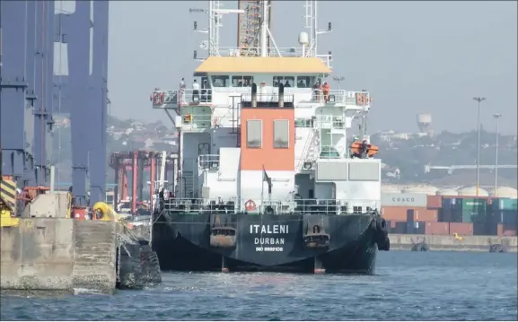  ??  ?? The Transnet dredger Italeni works against one of the Pier 1 container quays.