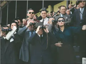  ?? PHOTOS:
ROBERT CAPA/
INTERNATIO­NAL
CENTER OF
PHOTOGRAPH­Y/
MAGNUM FILES ?? A 1952 photo by Robert Capa of spectators at the Longchamp Racecourse in Paris. Capa always carried two cameras, one with colour film and one with black and white.