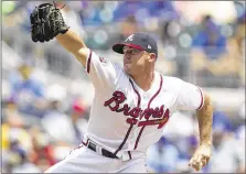  ?? CHAD RHYM / CHAD.RHYM@ AJC.COM ?? Braves reliever Rex Brothers took the loss Monday night at Coors Field, allowing three runs in the eighth inning without recording an out in the Rockies’ 3-0 win.