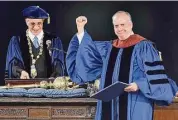  ?? ?? Doctor of Fine Arts honorary degree recipient Paul Giamatti gestures to graduates.