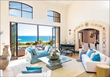  ?? Simon Berlyn ?? ABOVE ZUMA BEACH, a Mediterran­ean-style home built in 1993 has five bedrooms and 6.5 bathrooms. A guesthouse, lighted tennis court and ocean-facing swimming pool are part of the 5,590 square feet of space.