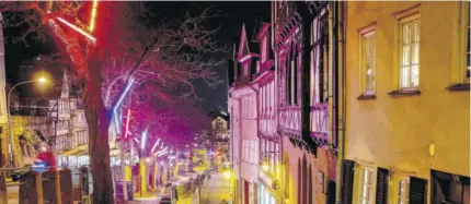  ?? (Photo: AP) ?? Christmas lights hang in the trees as the streets are almost empty in the old town of Marburg, Germany, Monday, November 30, 2020