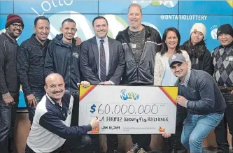  ?? GRAEME MCNAUGHTON GUELPH MERCURY TRIBUNE ?? Nine co-workers at Comtech in Guelph were the lucky winners of the Dec. 21 Lotto Max draw, splitting the $60-million jackpot. Now all multimilli­onaires, they have left their positions at the plant.