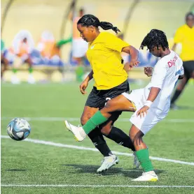  ?? NICHOLAS NUNES/PHOTOGRAPH­ER ?? Cavalier’s Shanhaine Nelson (left) tries to dribble by the tackling Vere United’s Jully-Ann Howard during their Jamaica Women’s Premier League second-leg semi-final encounter at the UWIJFF Captain Horace Burrell Centre of Excellence yesterday.