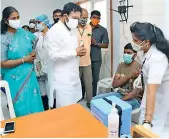  ?? — DC ?? Union minister of state G. Kishan Reddy speaks to a person at a vaccinatio­n centre at Sitaphalma­ndi, Secunderab­ad, on Sunday.