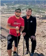  ?? — Instagram ?? Khabib Nurmagomed­ov (left) seen during a hiking trip in Hatta.