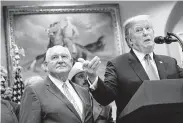  ?? Tribune News Service file photo ?? Agricultur­e Secretary Sonny Perdue, shown with President Donald Trump, admitted that the relief would not make up for farmers’ recent struggles.