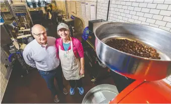  ??  ?? Co-owners and chocolate makers Mark Roedel and Michelle Scott-roedel enjoy the sweet life in their chocolate factory at Ten Degrees Chocolate. Both spent significan­t time apprentici­ng to learn the chocolate trade first-hand.