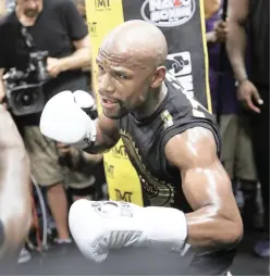  ?? AP ?? READY TO RUMBLE: Floyd Mayweather trains at his gym ahead of his much-anticipate­d fight with Conor McGregor.