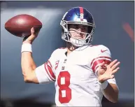  ?? Kamil Krzaczynsk­i / Associated Press ?? New York Giants quarterbac­k Daniel Jones looks to pass the ball against the Chicago Bears during the first half on Sunday.