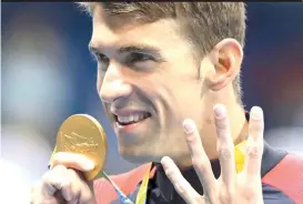  ??  ?? In this Aug. 11, 2016, file photo, United States’ Michael Phelps celebrates winning the gold medal in the men’s 200-meter individual medley during the swimming competitio­ns at the Summer Olympics in Rio de Janeiro, Brazil.AP